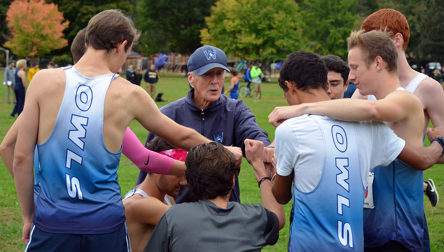 Bill Devine coaches his team before the 2018 James Earley Meet.
